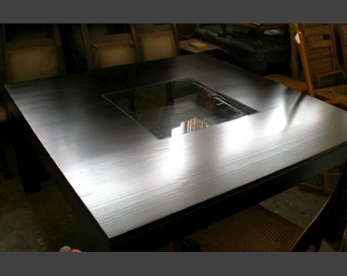 Table manufactured for a retail shop, containing a well with seashells. Table