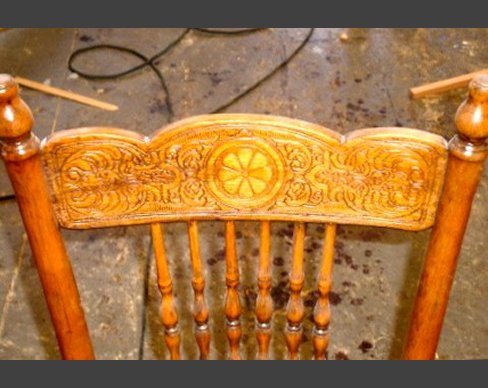 Back of chair repaired and carved to match original. Chair back